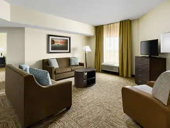 Living room of the Candlewood 1 King 2 Queen Beds 2 Bedroom Suite
